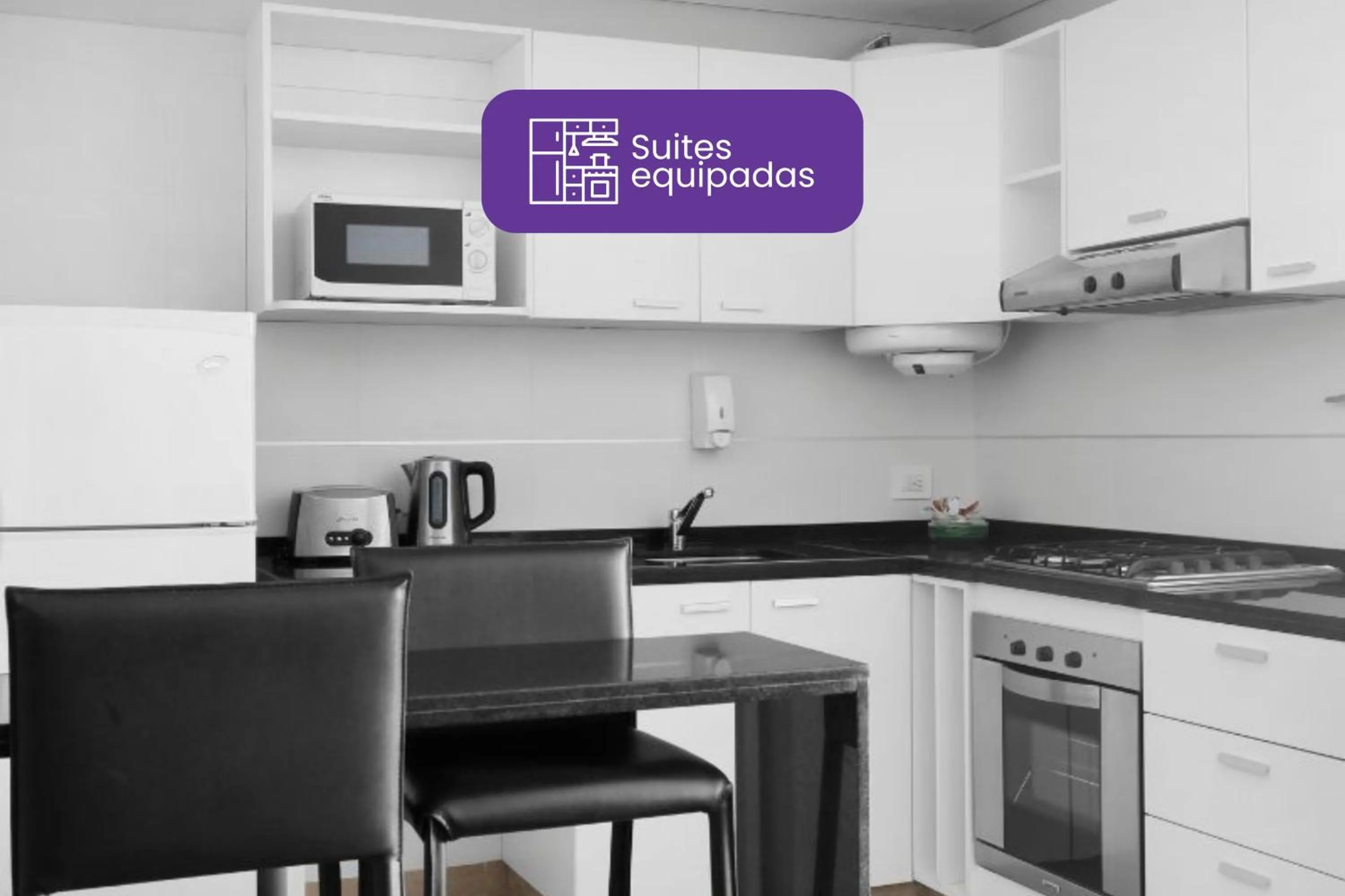 Kitchen or kitchenette in Reco by DOT Suites