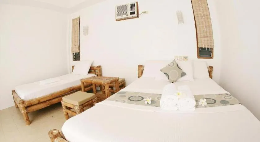 Bed in Elysia Beach Resort