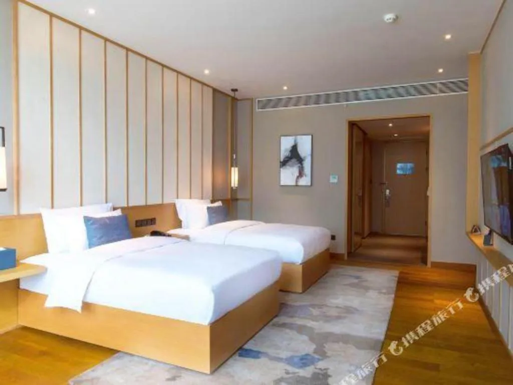 Bed in The Mulian Urban Resort Hotels Huadu