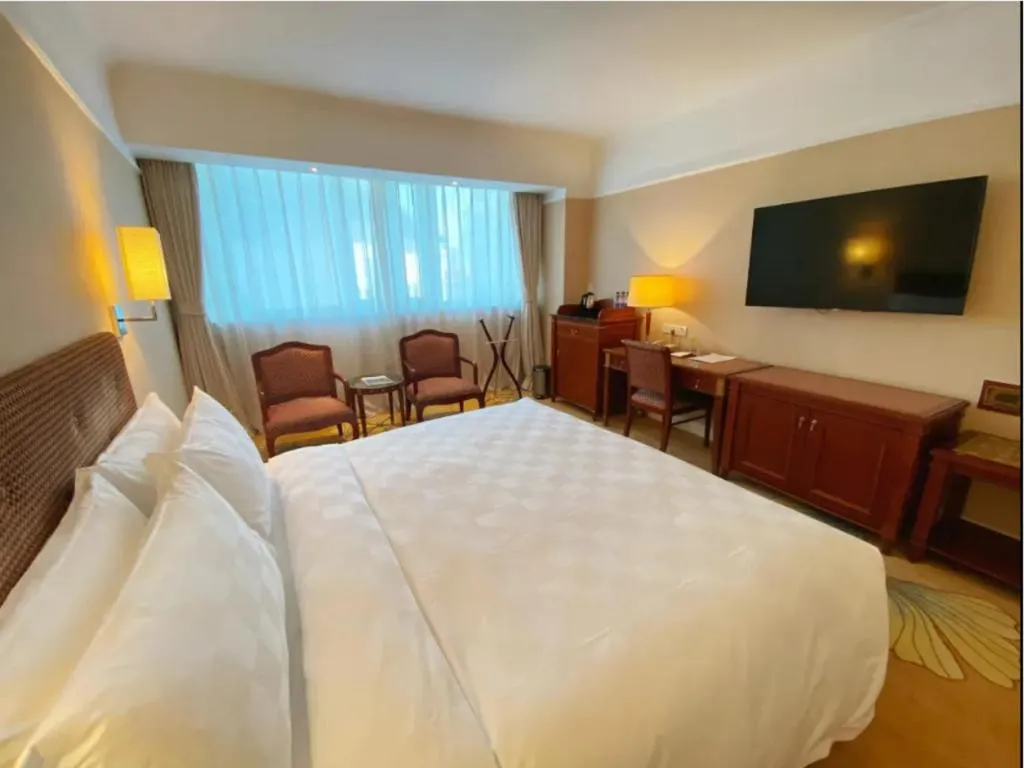 Bed in Jianguo Garden Hotel