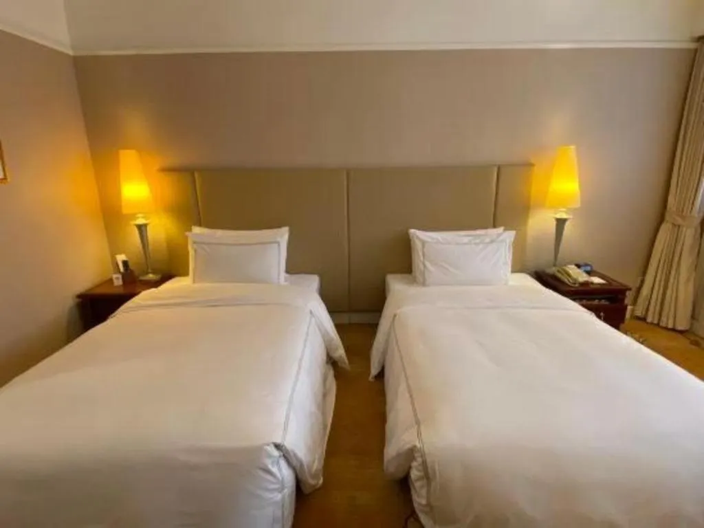 Bed in Jianguo Garden Hotel