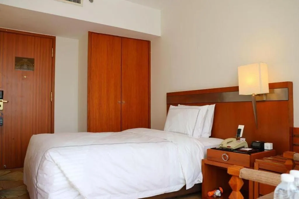 Bed in Jianguo Garden Hotel