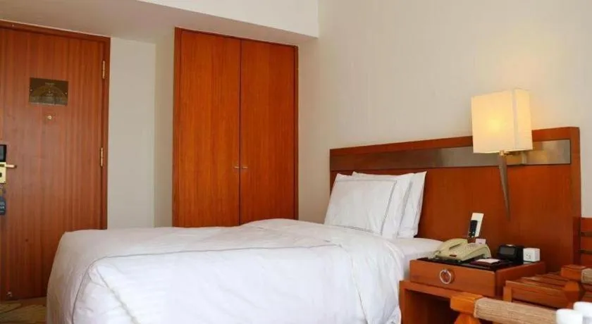 Bed in Jianguo Garden Hotel