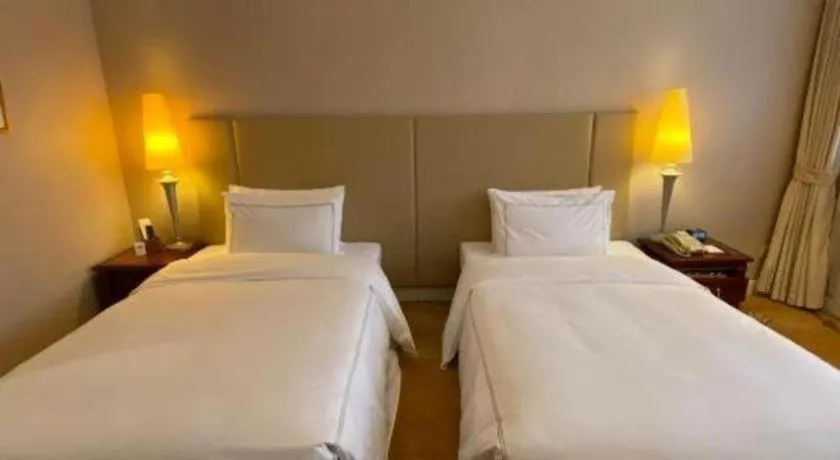 Bed in Jianguo Garden Hotel