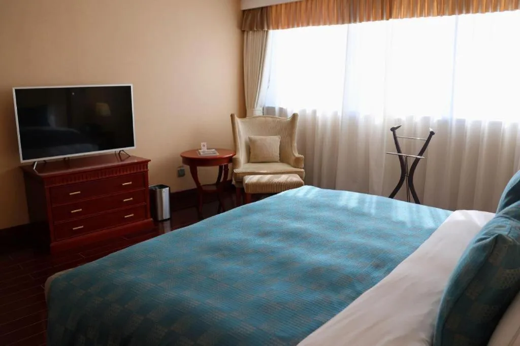 Bed in Jianguo Garden Hotel