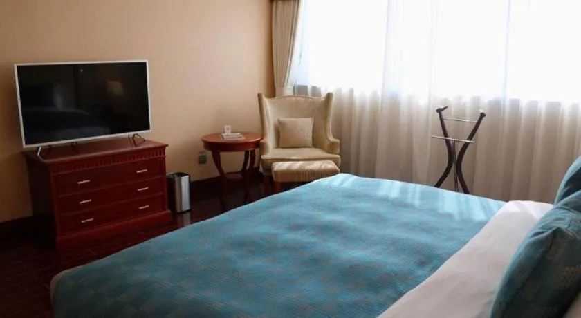 Bed in Jianguo Garden Hotel