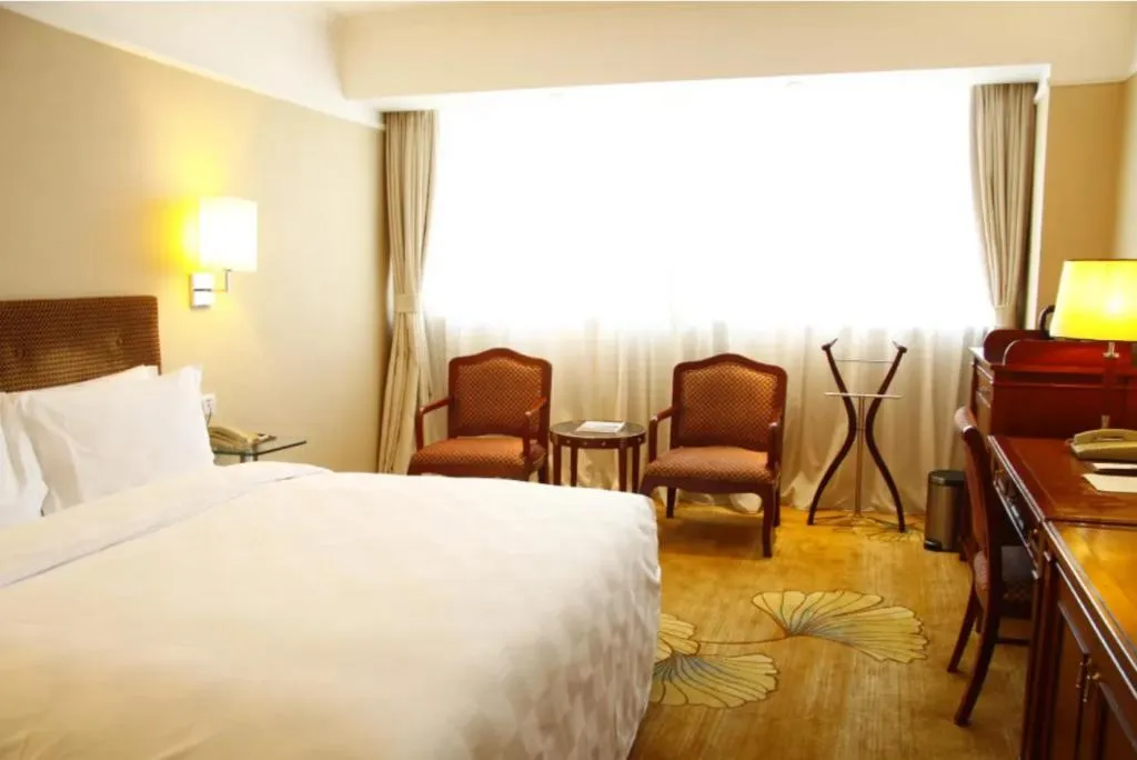 Bed in Jianguo Garden Hotel