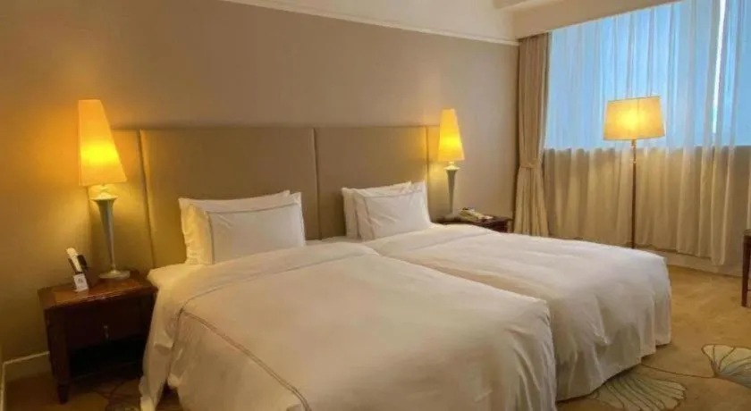 Bed in Jianguo Garden Hotel