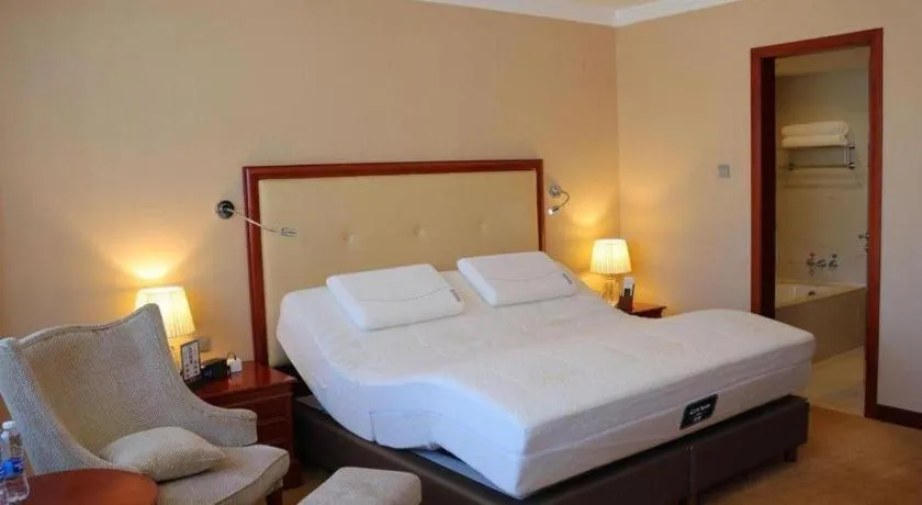 Bed in Jianguo Garden Hotel