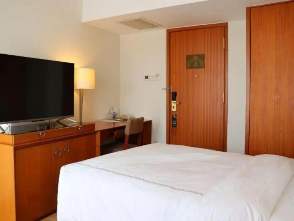 Bed in Jianguo Garden Hotel