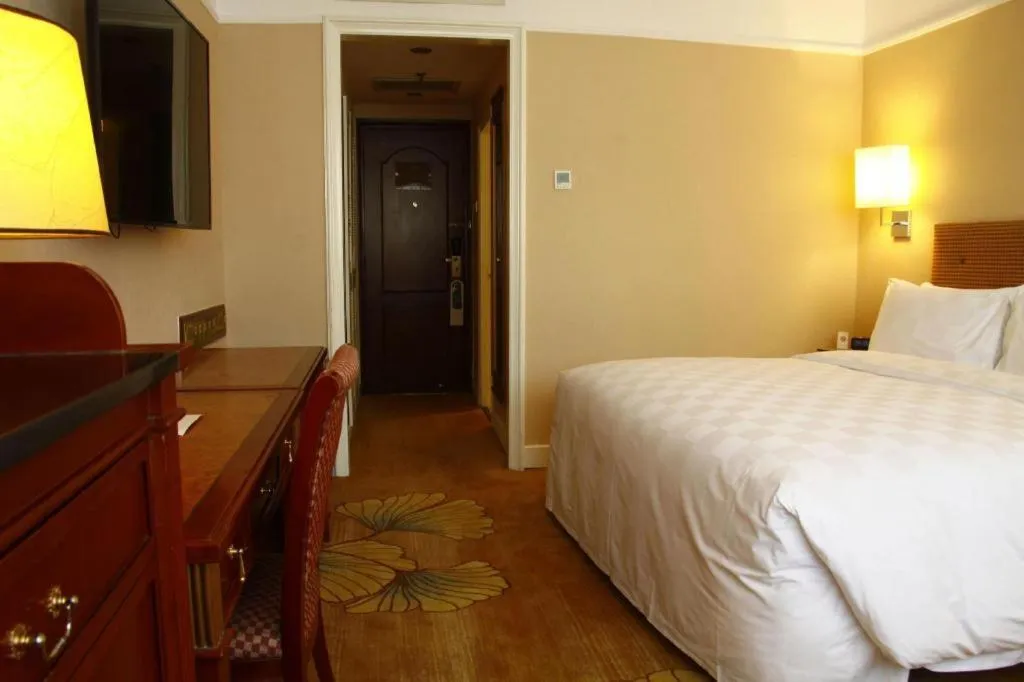 Bed in Jianguo Garden Hotel