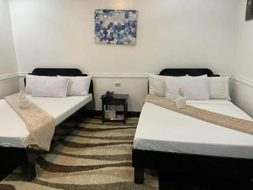 Bed in Vest Grand Suites