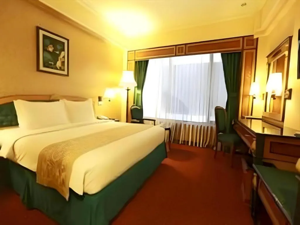 Bed in Gajahmada Graha Hotel