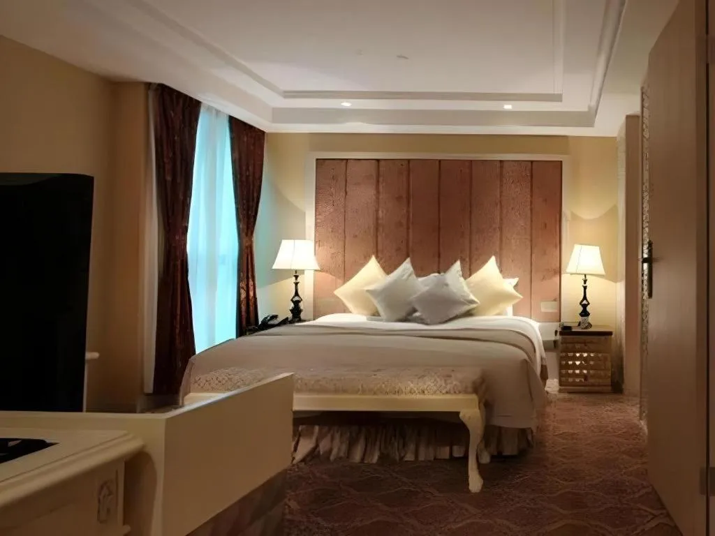 Bed in Yihe Grand Hotel