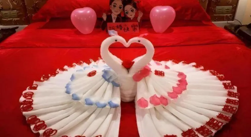 Bed in Yihe Grand Hotel