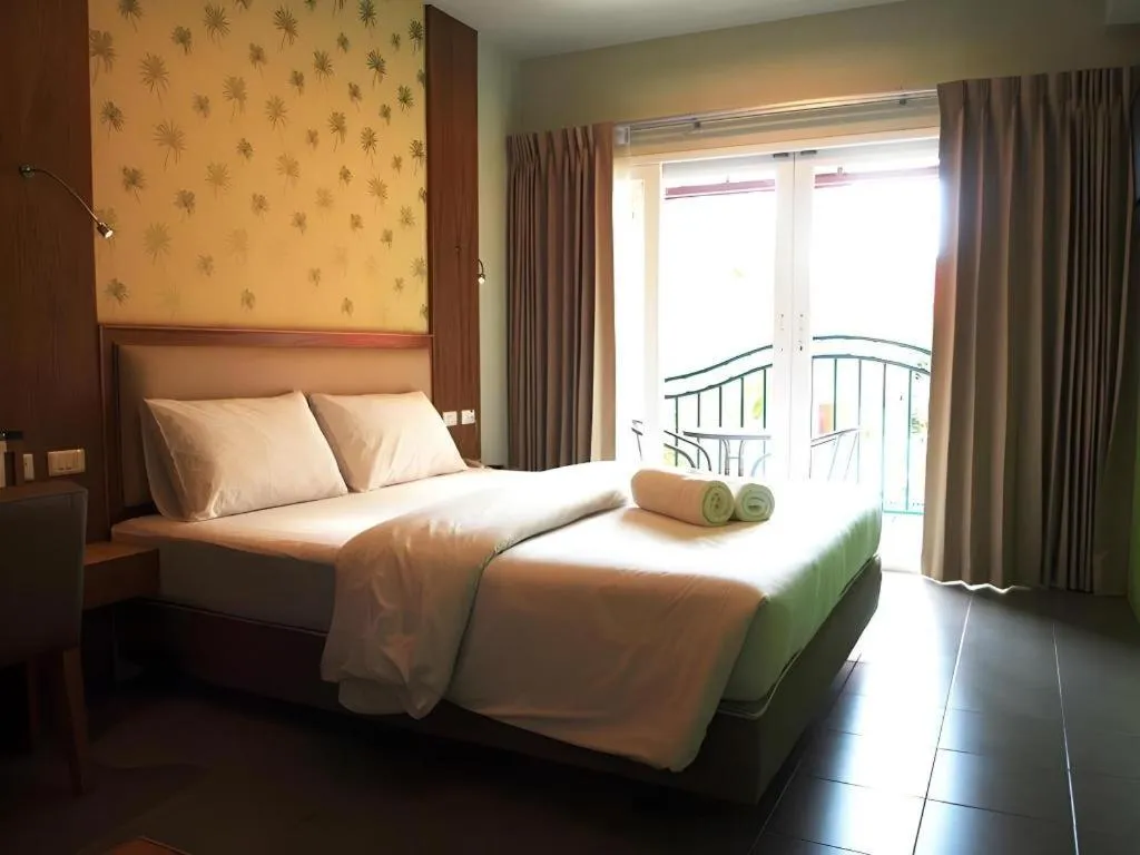 Bed in Phuket Ecozy Hotel