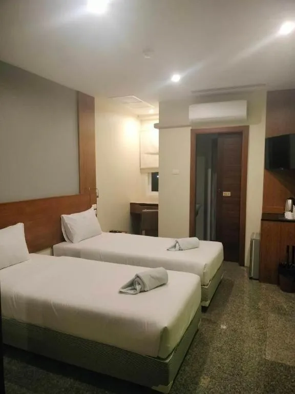 Bed in Phuket Ecozy Hotel