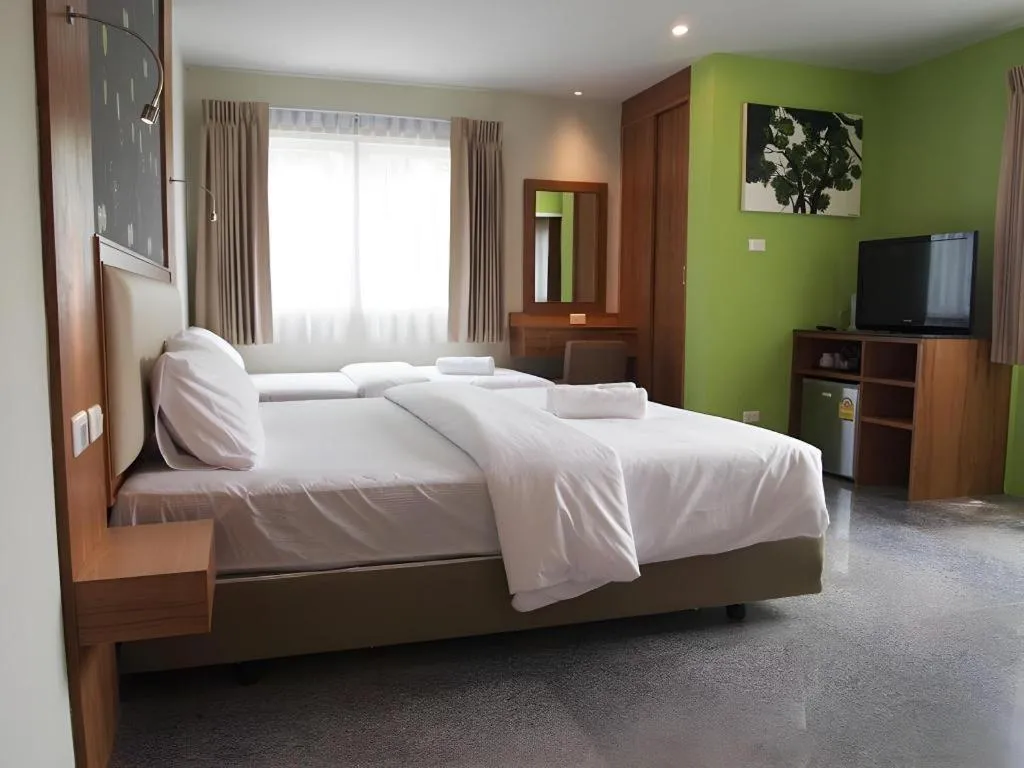 Bed in Phuket Ecozy Hotel