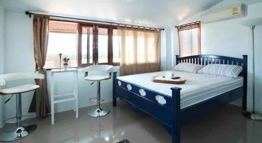 Bed in The Royal Chiangkhan Boutique Hotel