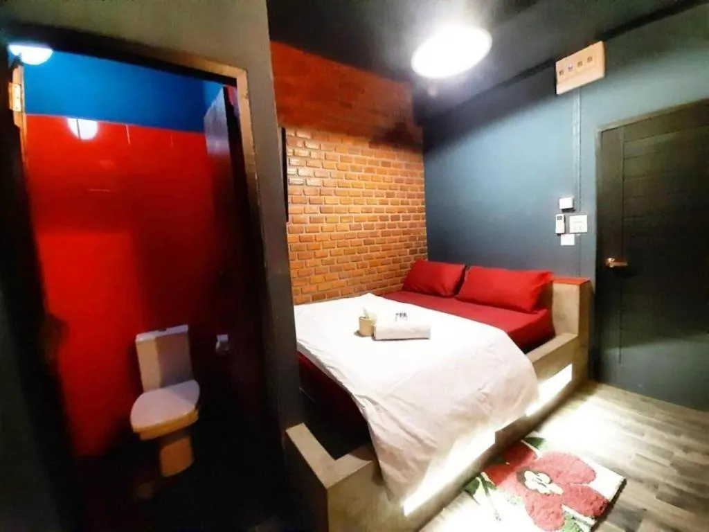 Bed in The Royal Chiangkhan Boutique Hotel