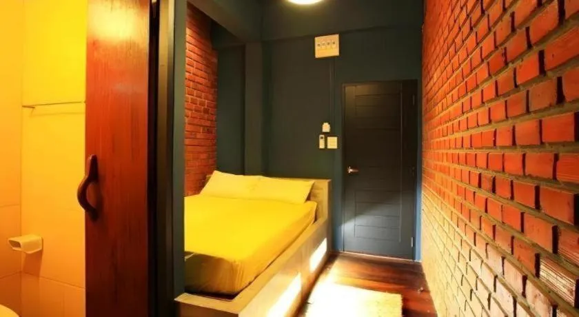 Bed in The Royal Chiangkhan Boutique Hotel