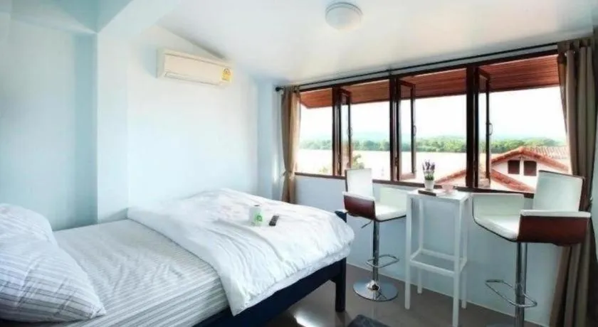 Bed in The Royal Chiangkhan Boutique Hotel