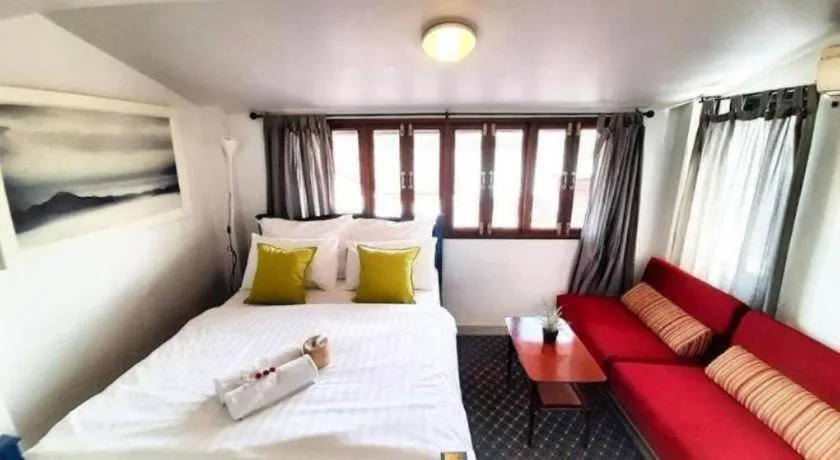 Bed in The Royal Chiangkhan Boutique Hotel