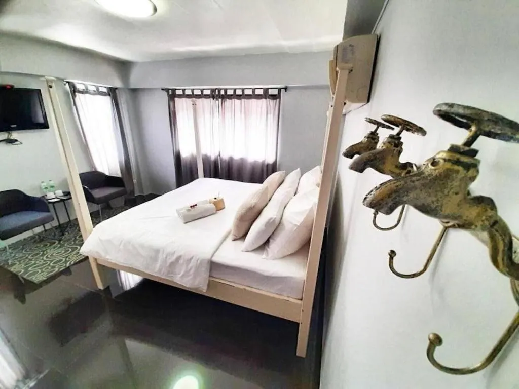 Bed in The Royal Chiangkhan Boutique Hotel