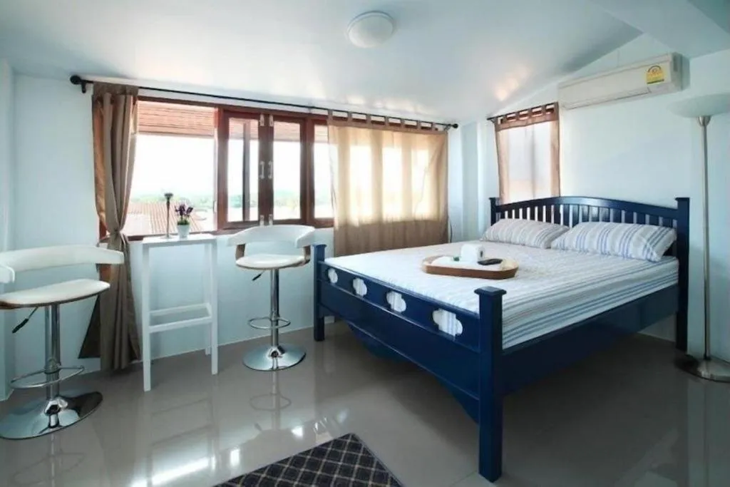 Bed in The Royal Chiangkhan Boutique Hotel