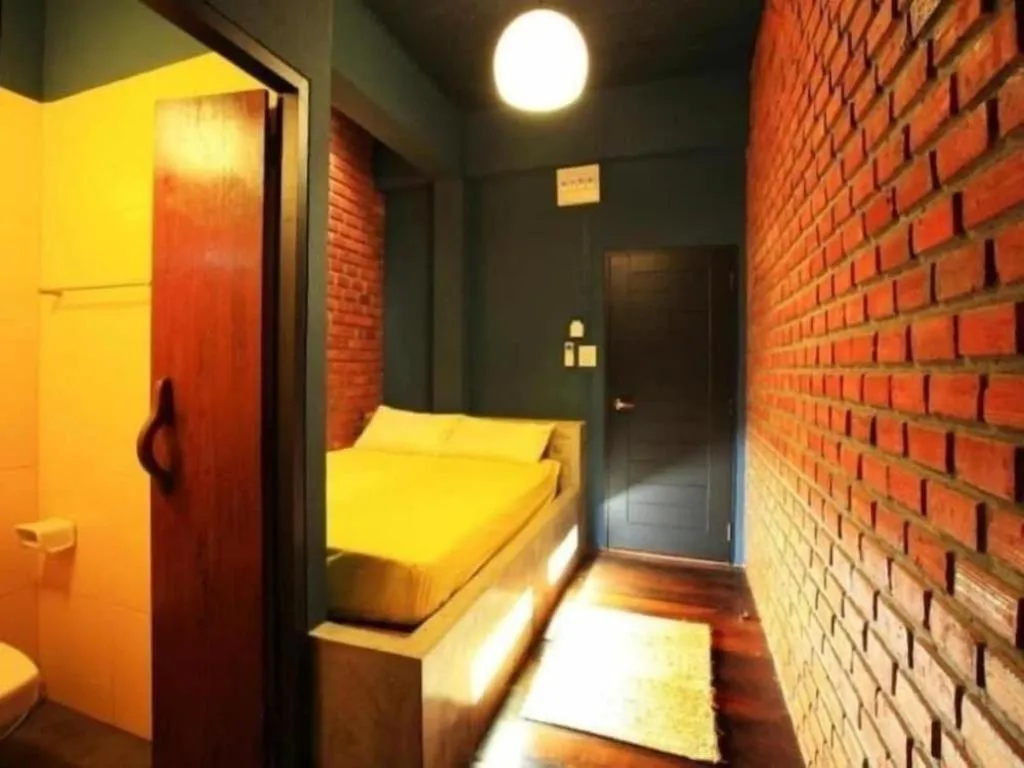 Bed in The Royal Chiangkhan Boutique Hotel