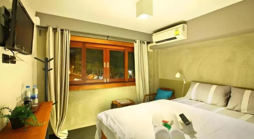 Bed in Chic Chiangkhan Hotel