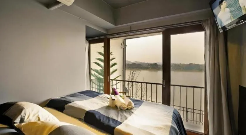 Bed in Chic Chiangkhan Hotel