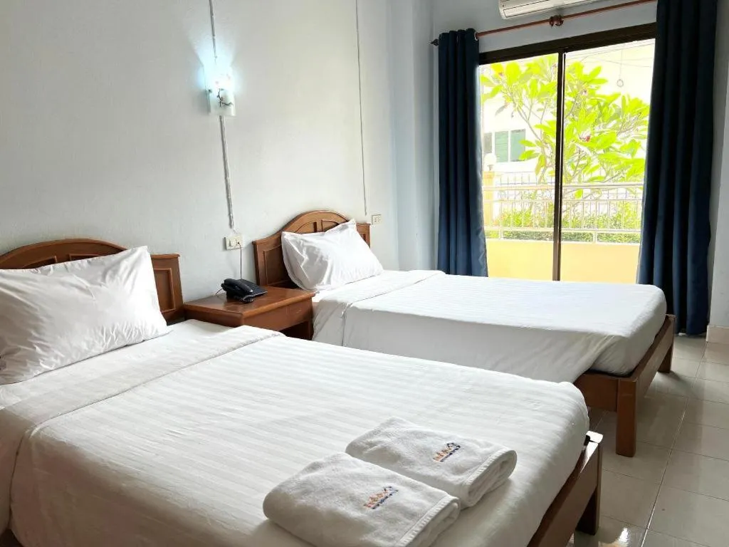 Bed in Ritzy House Hotel