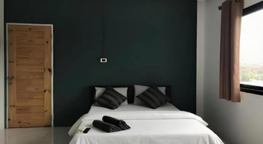 Bed in The Color Express Hotel