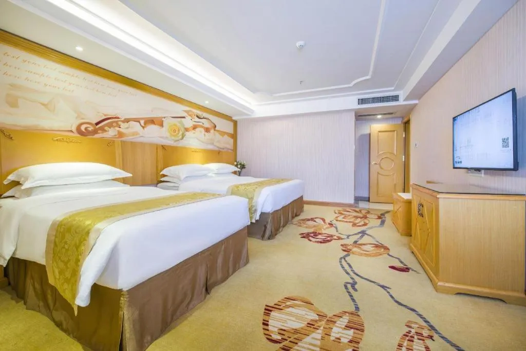 Bed in Vienna Hotel Guangzhou Panyu Shiqiao Center Branch