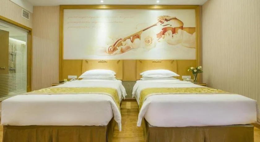 Bed in Vienna Hotel Guangzhou Panyu Shiqiao Center Branch