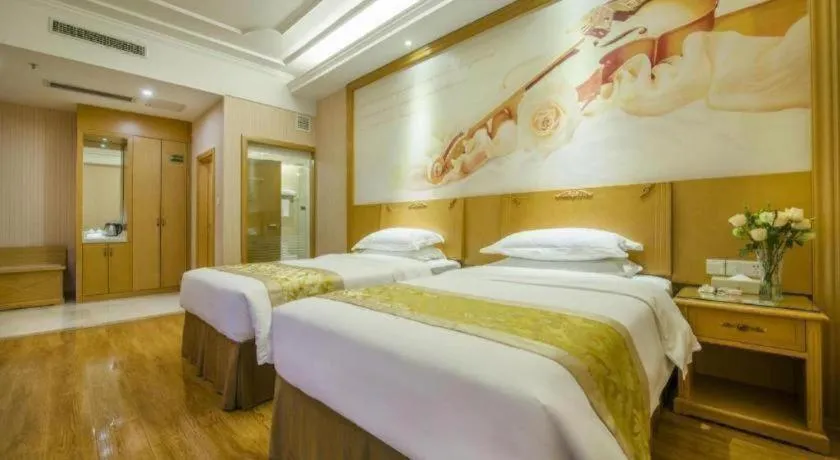 Bed in Vienna Hotel Guangzhou Panyu Shiqiao Center Branch