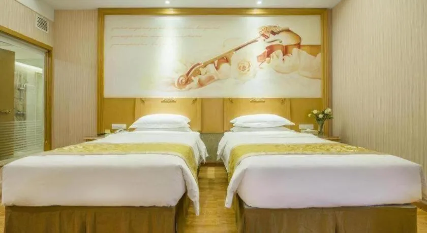 Bed in Vienna Hotel Guangzhou Panyu Shiqiao Center Branch