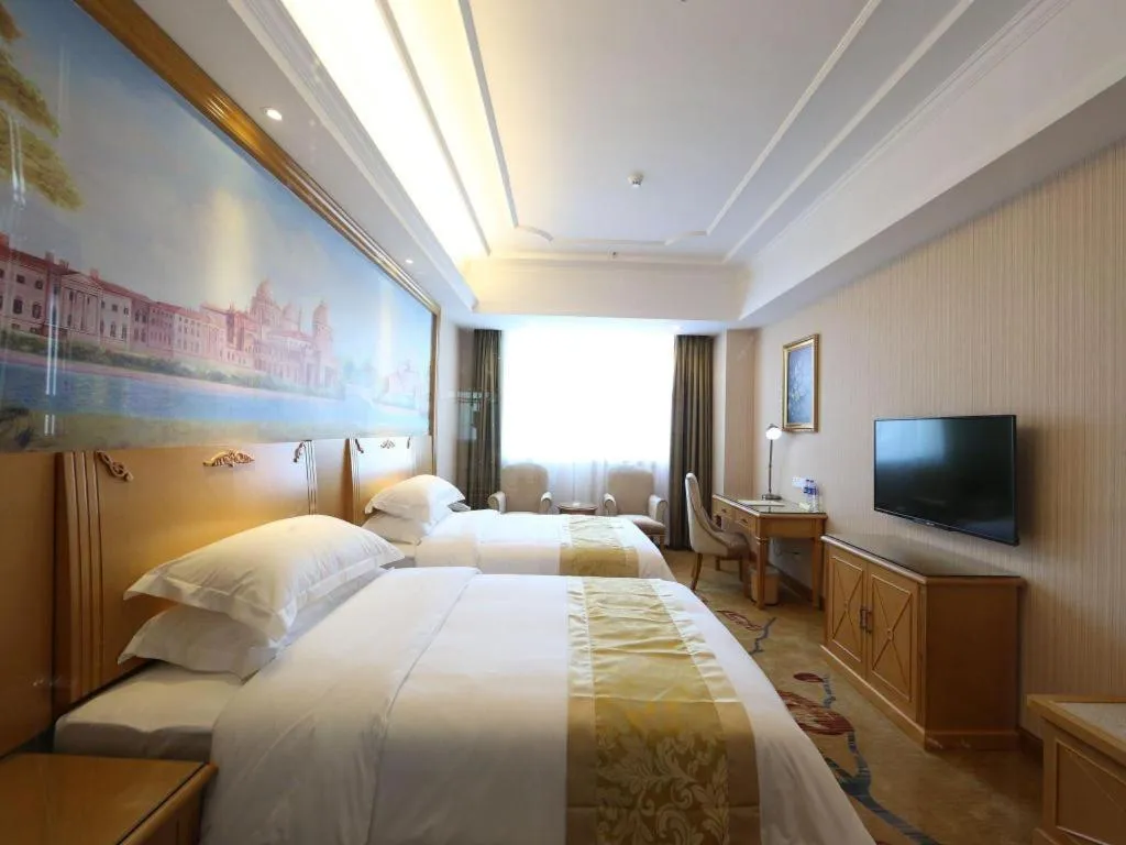 Bed in Vienna Hotel Guangzhou Panyu Shiqiao Center Branch