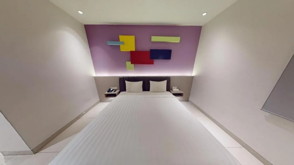 Bed in Zoom Dharmahusada Hotel