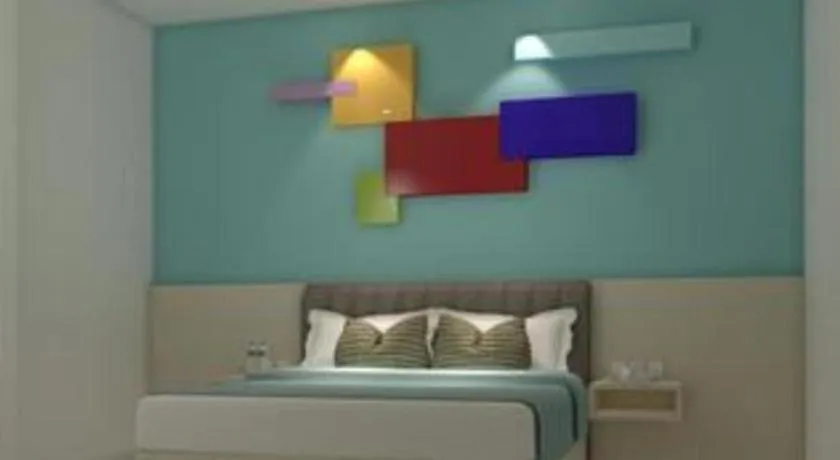 Bed in Zoom Dharmahusada Hotel