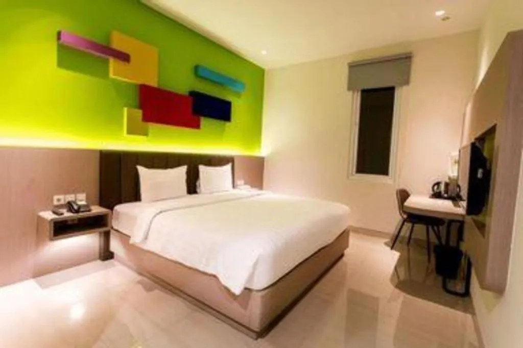 Bed in Zoom Dharmahusada Hotel