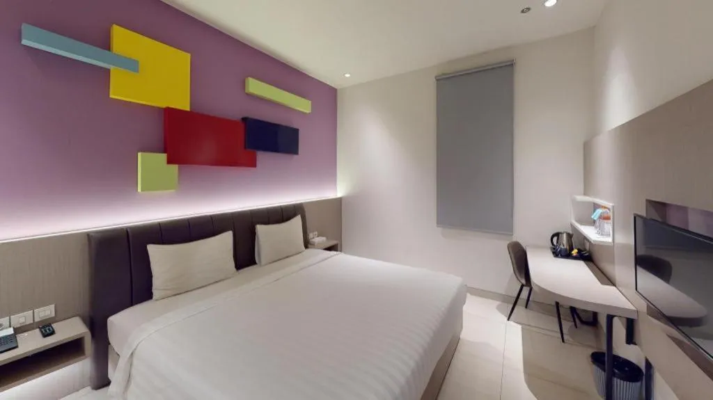 Bed in Zoom Dharmahusada Hotel