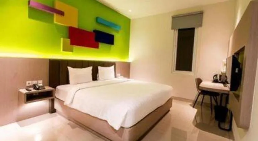 Bed in Zoom Dharmahusada Hotel