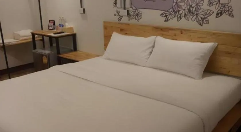 Bed in QBix Hotel
