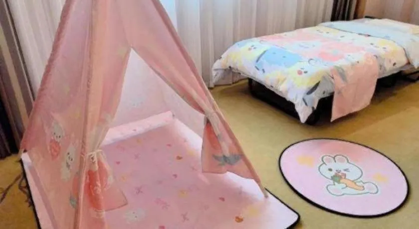 Bed in Vienna International Hotel Shanghai Dishui Lake Lingang Wanda