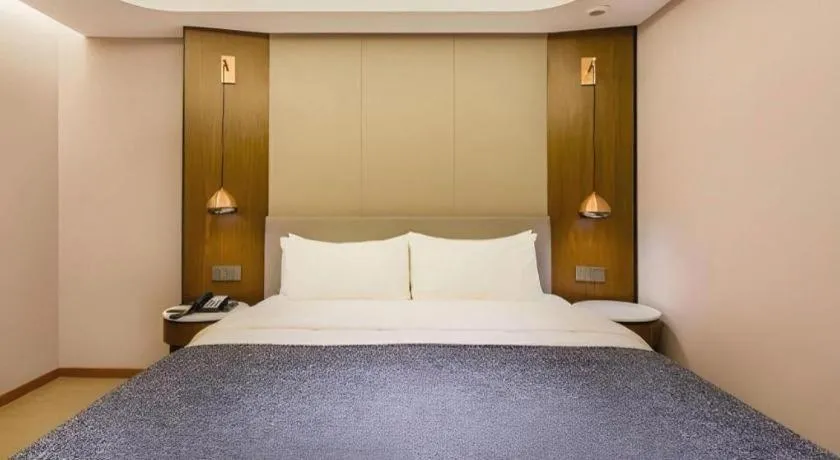 Bed in Yitel Collection Beijing Capital Airport New International Exhibition