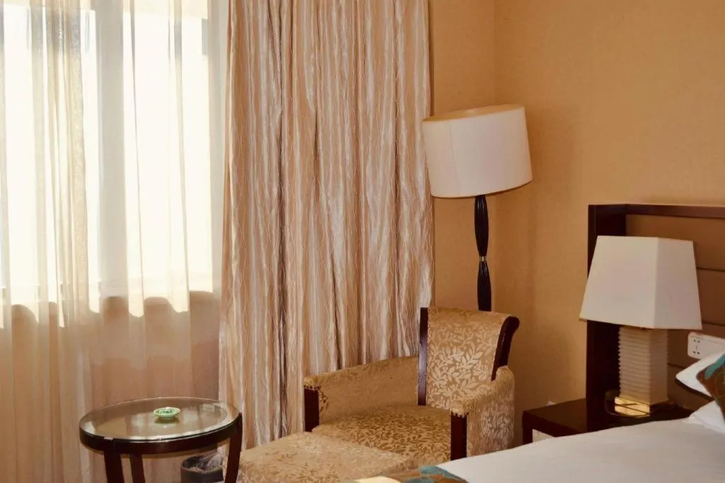 Bed in New Century Grand Hotel Lishui Huaqiao