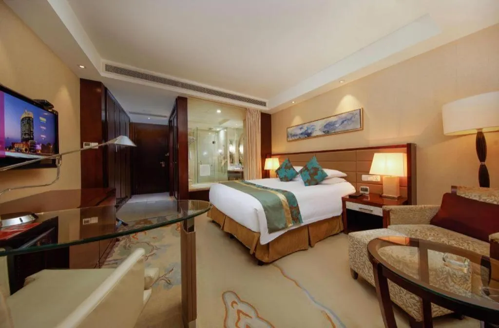 Bed in New Century Grand Hotel Lishui Huaqiao