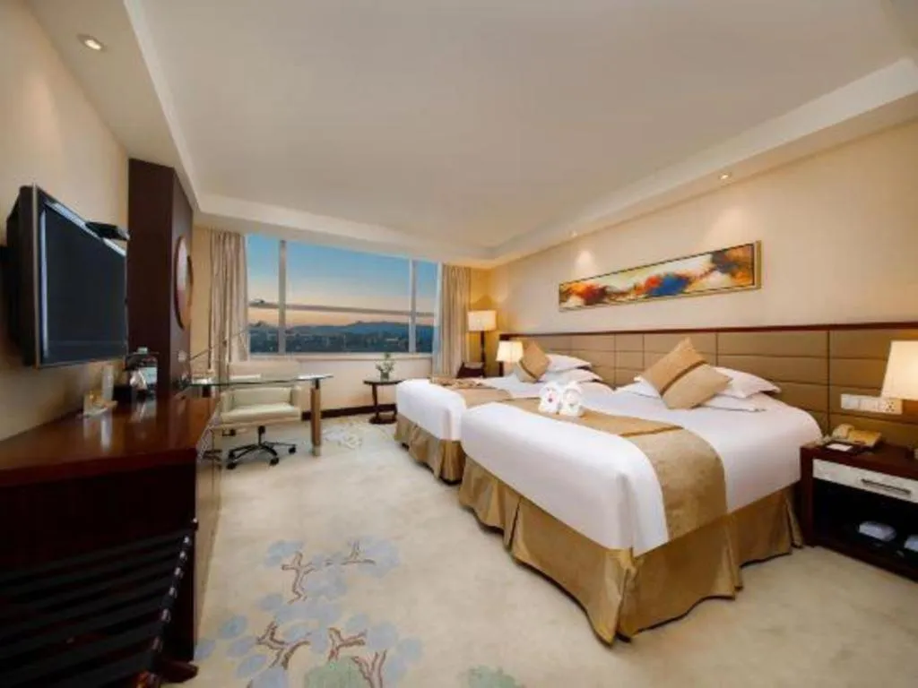 Bed in New Century Grand Hotel Lishui Huaqiao